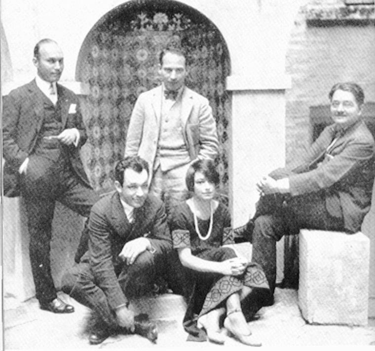 Members of the Algonquin Round Table: (standing, left to right) Art Samuels and Harpo Marx;; (sitting) Charles MacArthur, Dorothy Parker, and Alexander Woollcut